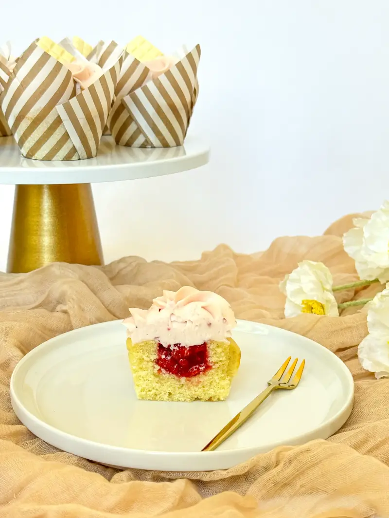 cut inside of vanilla strawberry cupcake Active Image