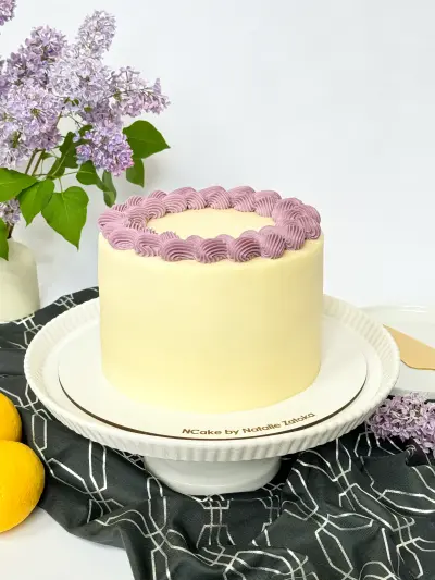 whole poppy lemon cake on the cake board