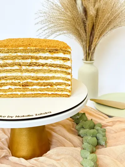 half of honey cake on the cake stand 95