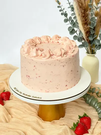 whole vanilla strawberry cake on the cake stand
